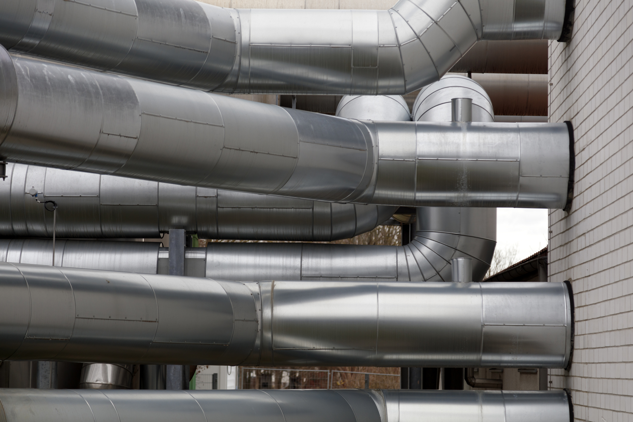 Pipes, tanks, water valves and other outdoor installations of a residential district heating plant.