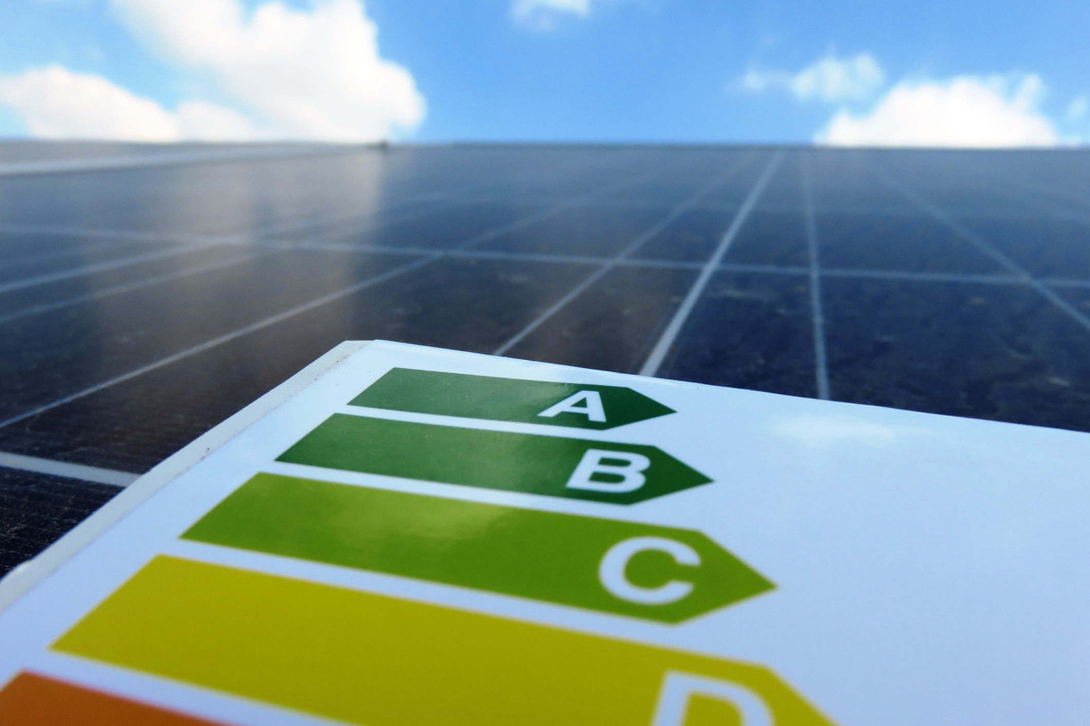 Energy label, against the background of a solar panel