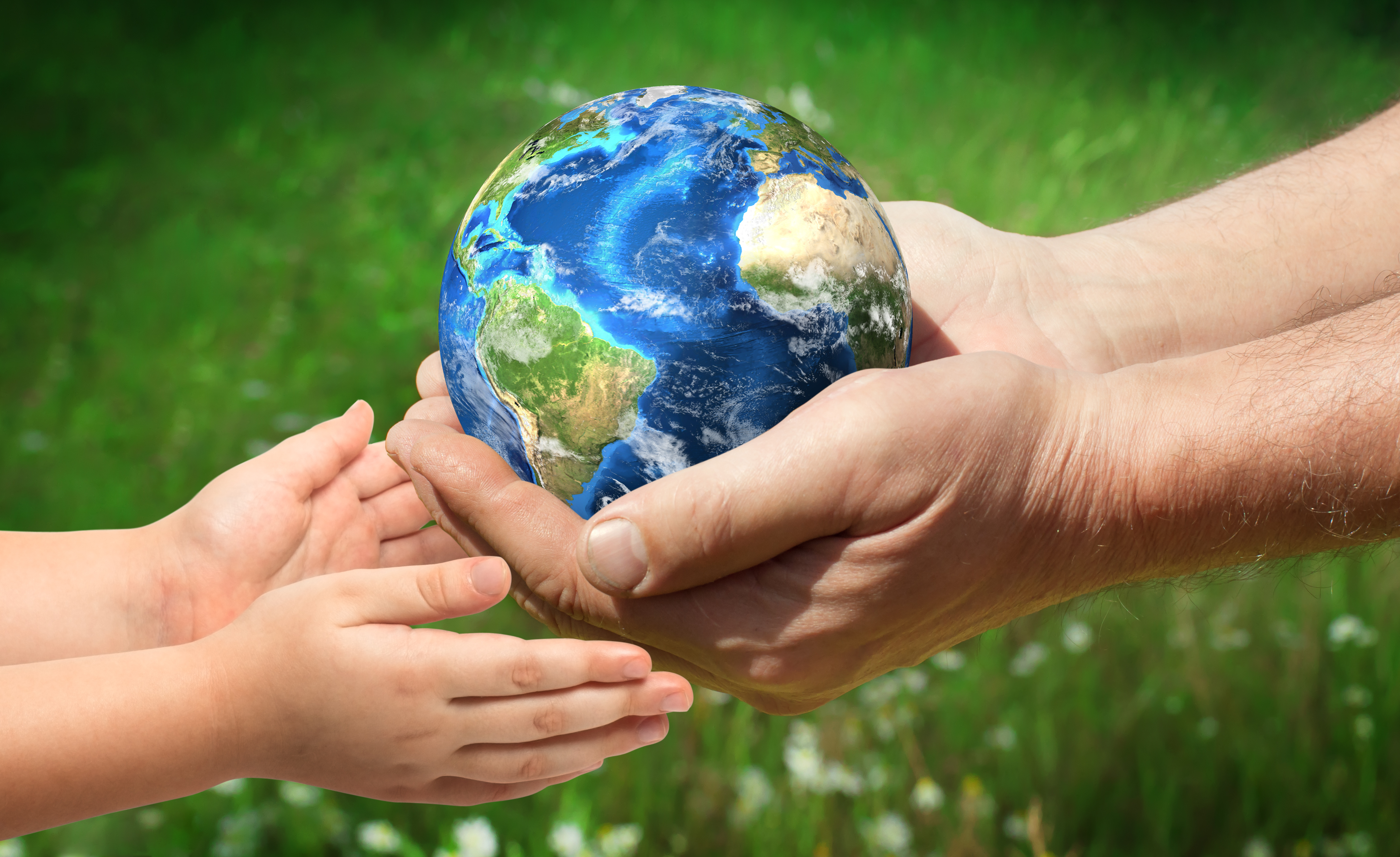 The man gives planet Earth to baby. Ecology concept, earth day. Elements of this image furnished by NASA (https://visibleearth.nasa.gov/)